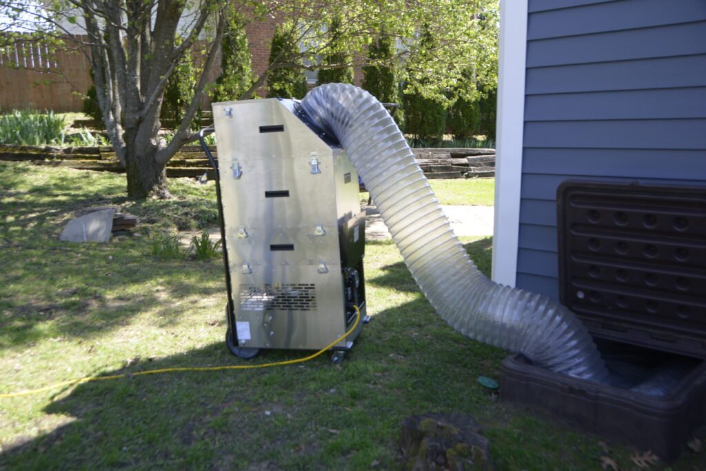 A large Vacuum machine used to contain dust and particulates entering a crawlspace.